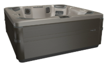 A dark gray rectangular hot tub with seating and a control panel, outdoors.