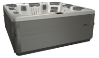 Gray and tan rectangular hot tub with jets, built-in seating, and a control panel.