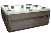 Hot tub with a brown wooden exterior and white interior.