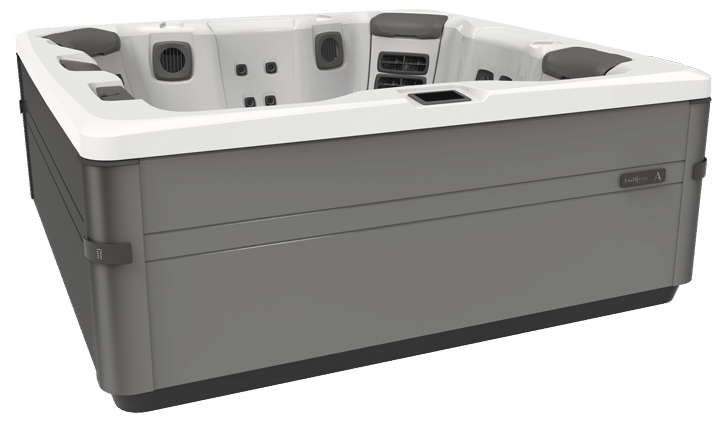 Gray and white hot tub with multiple jets and headrests, set outdoors.