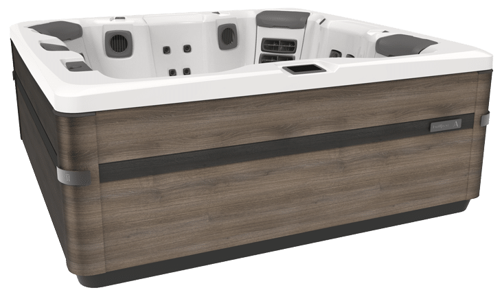 Hot tub with gray and wood-grain exterior. White interior seats.