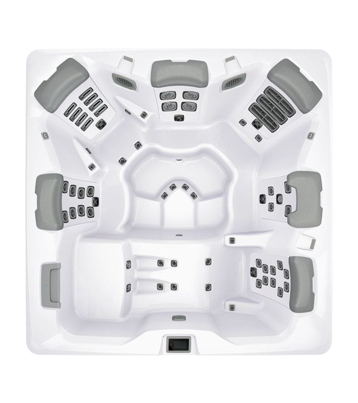 Overhead view of a white square hot tub with gray headrests and various jets.