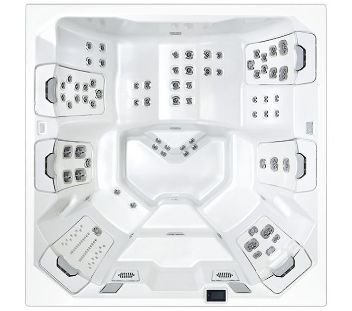 Top-down view of a white, square hot tub with multiple seats, jets, and control panel.