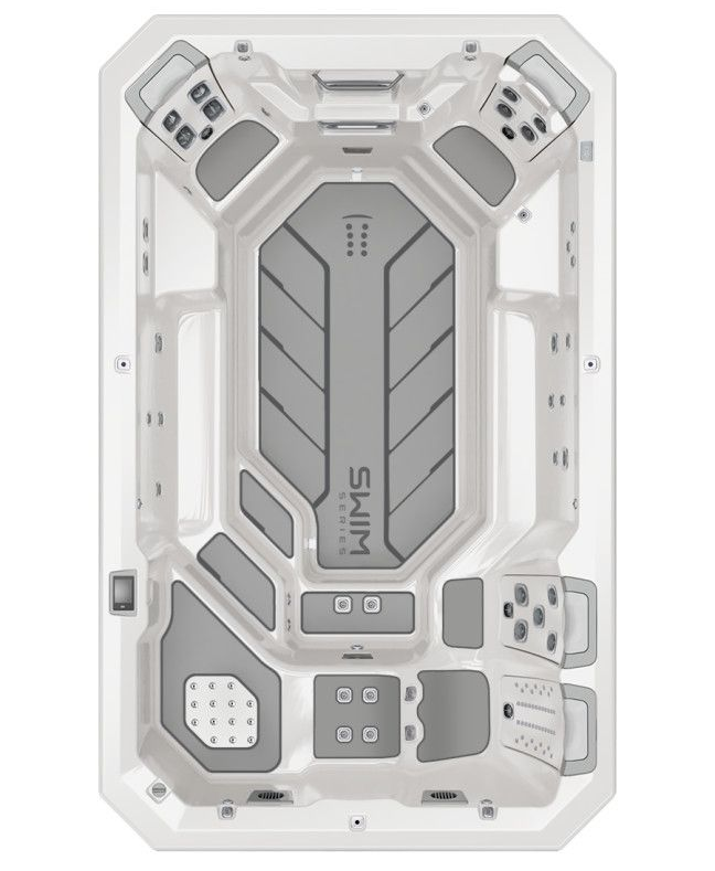 Top-down view of a white swim spa with gray interior, jets, and controls.