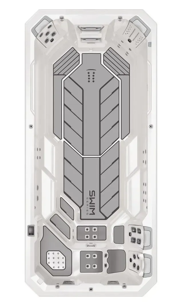 Top-down view of a gray and white swim spa, showing jets and interior layout.