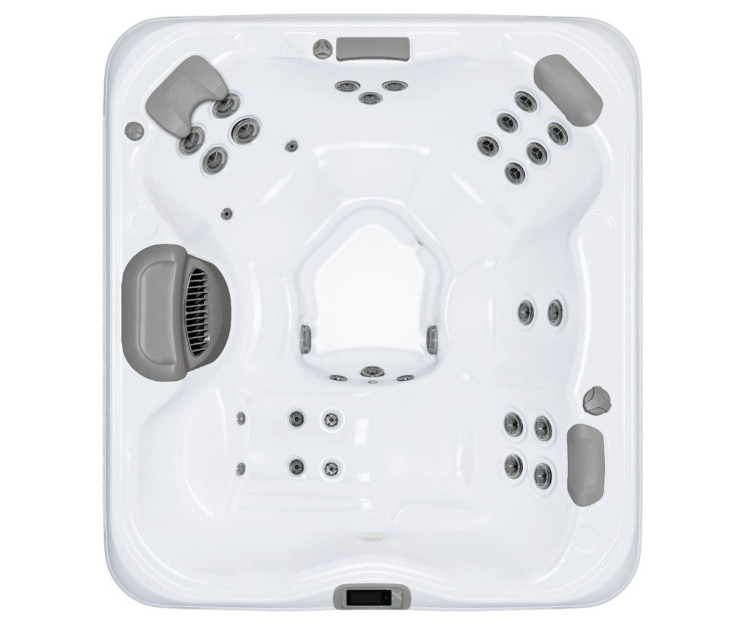 Top-down view of a white square hot tub with gray headrests and jets, set outdoors.
