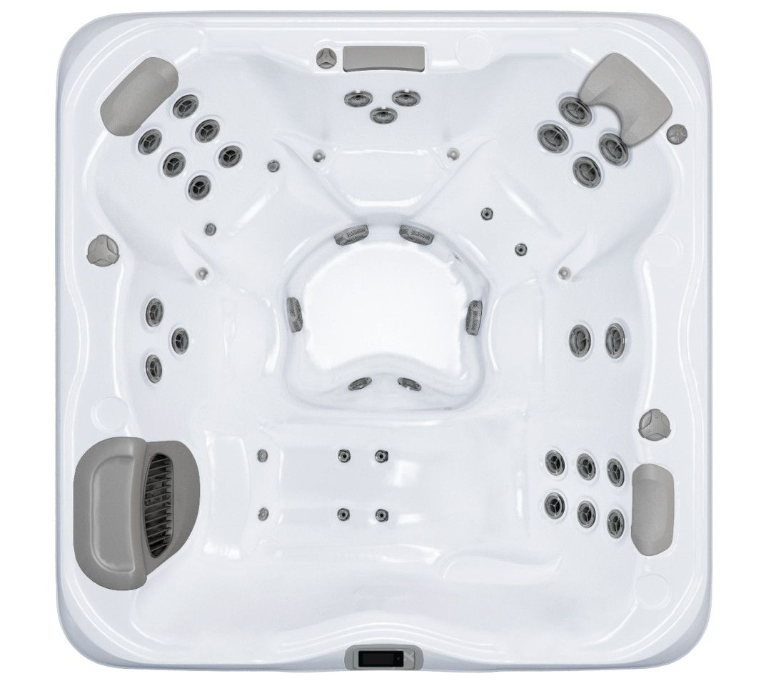 Top-down view of a white hot tub with multiple jets and gray headrests.