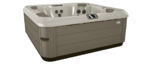 A square hot tub with a tan exterior and white interior.