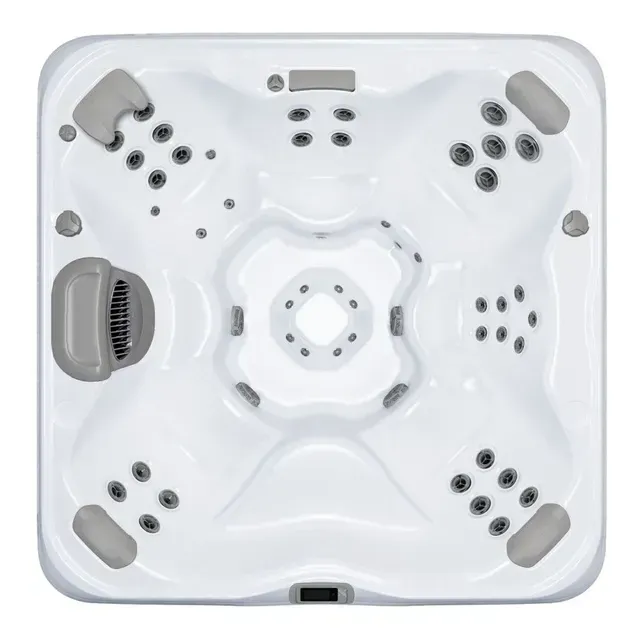 Overhead view of a white square hot tub with several jet clusters, gray headrests, and a central, shallow seating area.