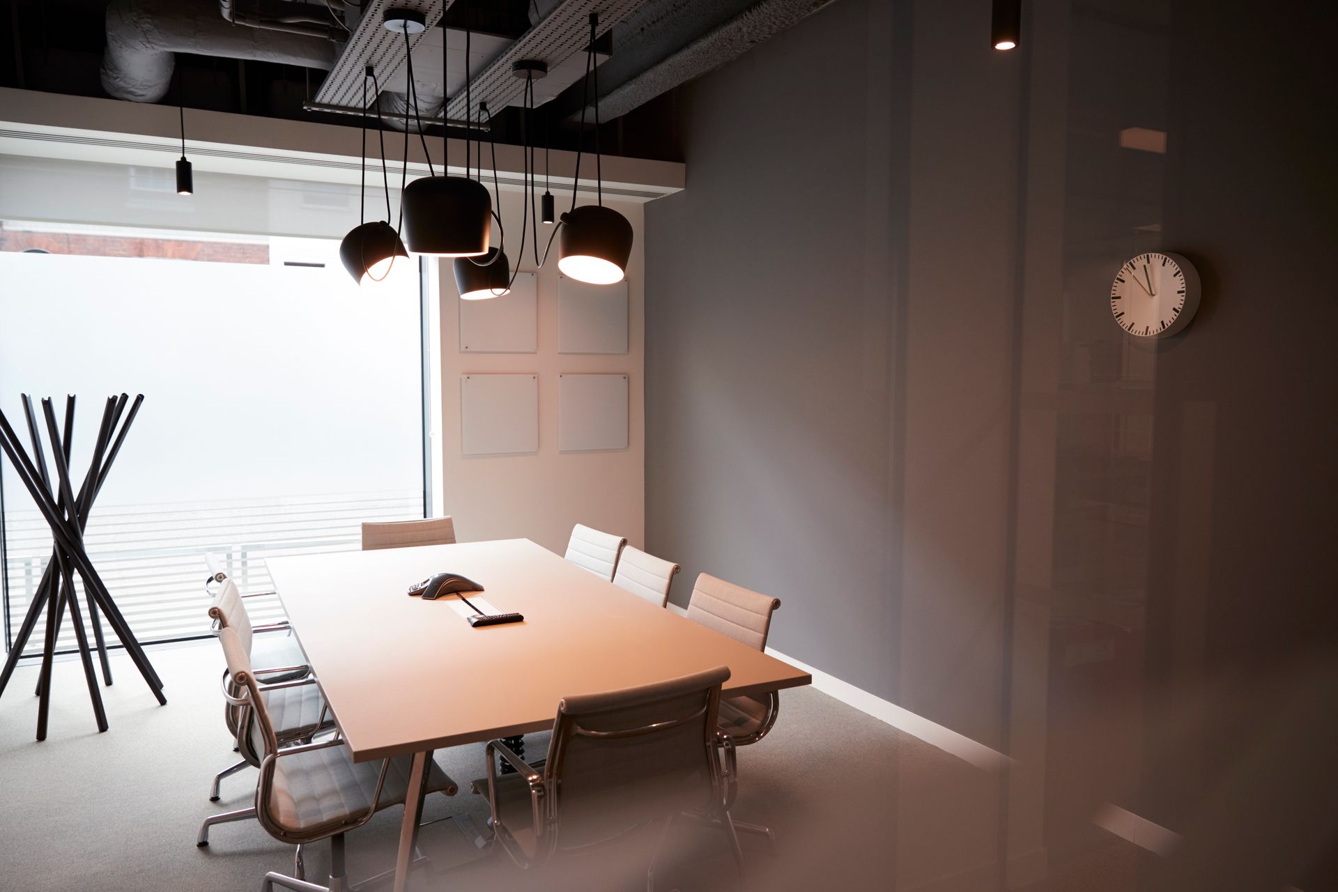 chairs around boardroom table in modern commercial space