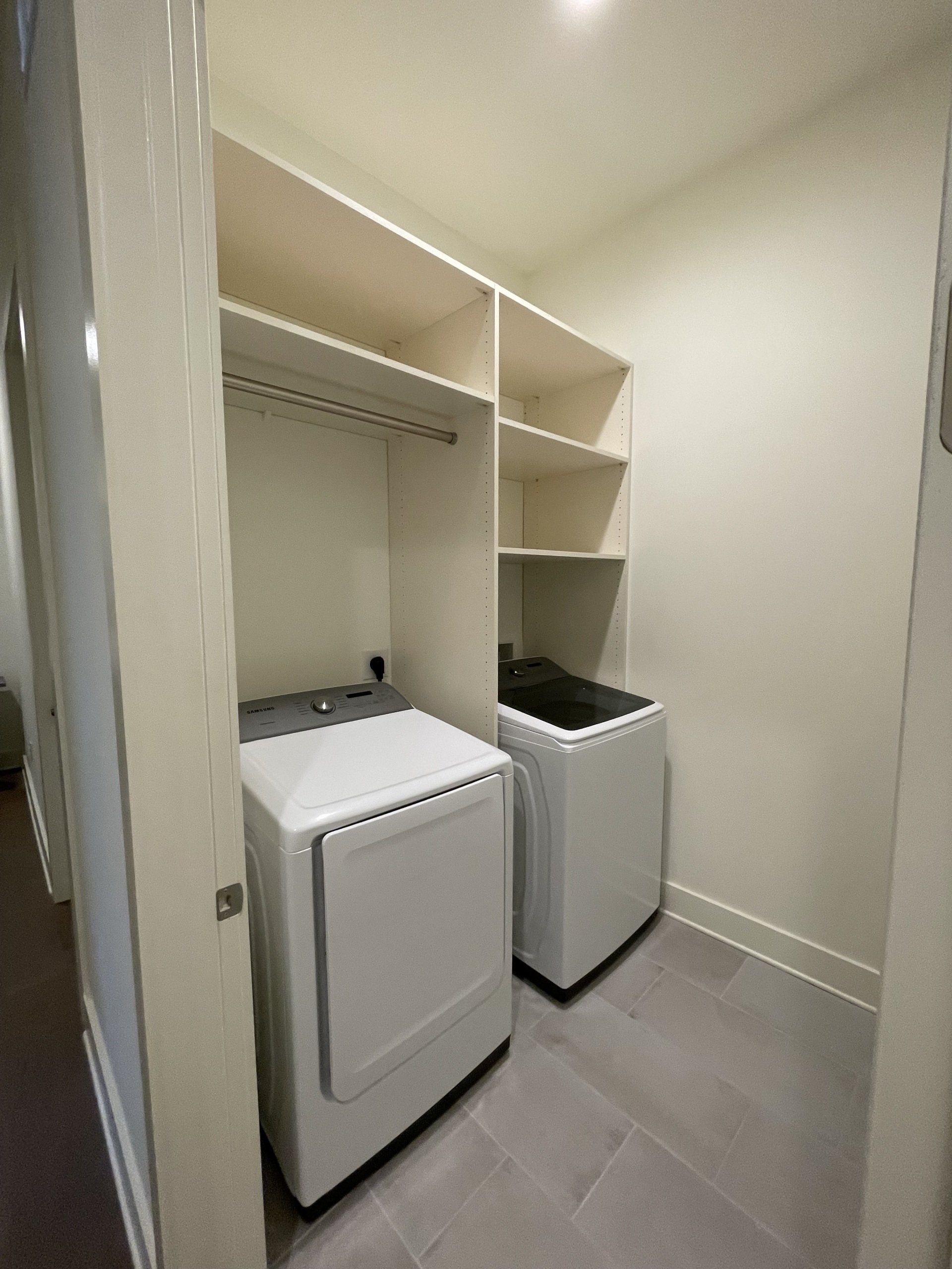 A laundry room with a washer and dryer in it.