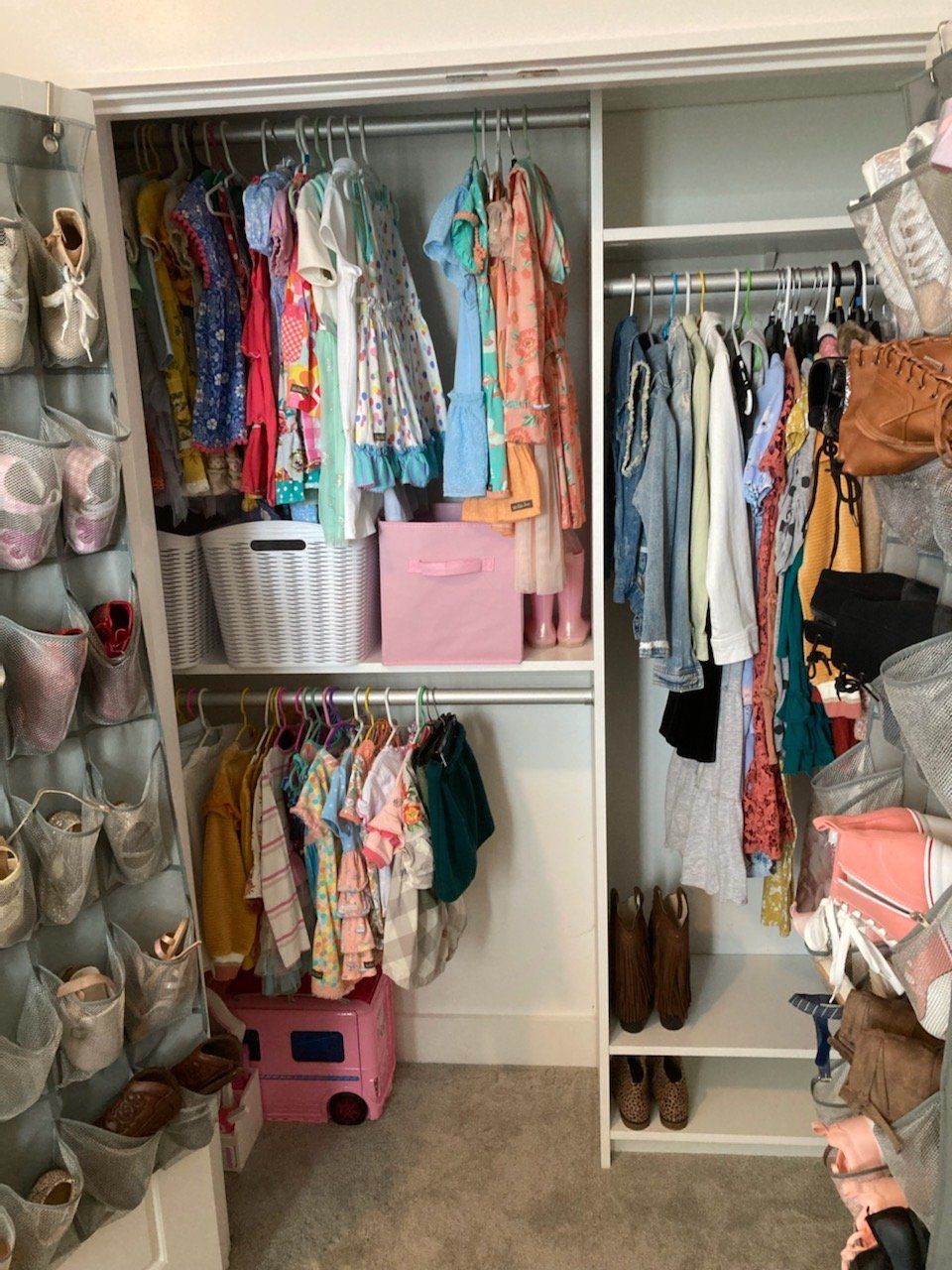 A closet filled with lots of clothes and shoes.