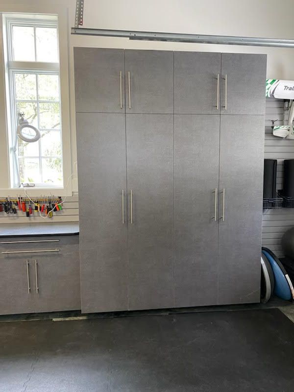A garage with a lot of cabinets and a window