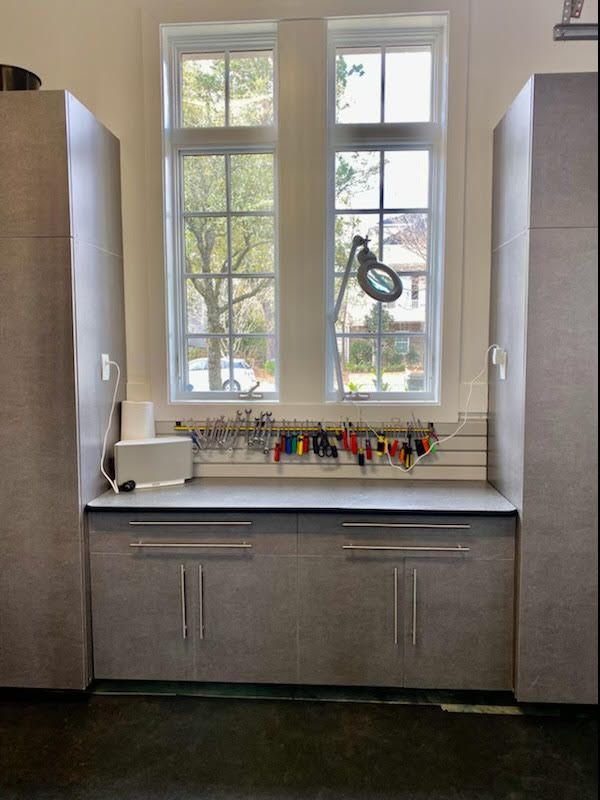 A kitchen with a lot of cabinets and a window