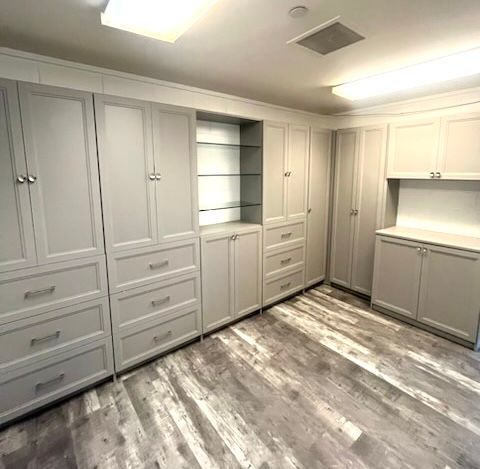 There are a lot of cabinets and drawers in this room.