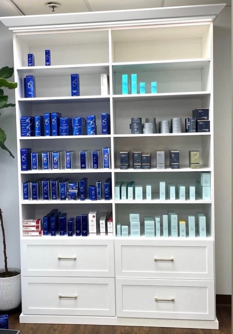 A shelf filled with a variety of beauty products