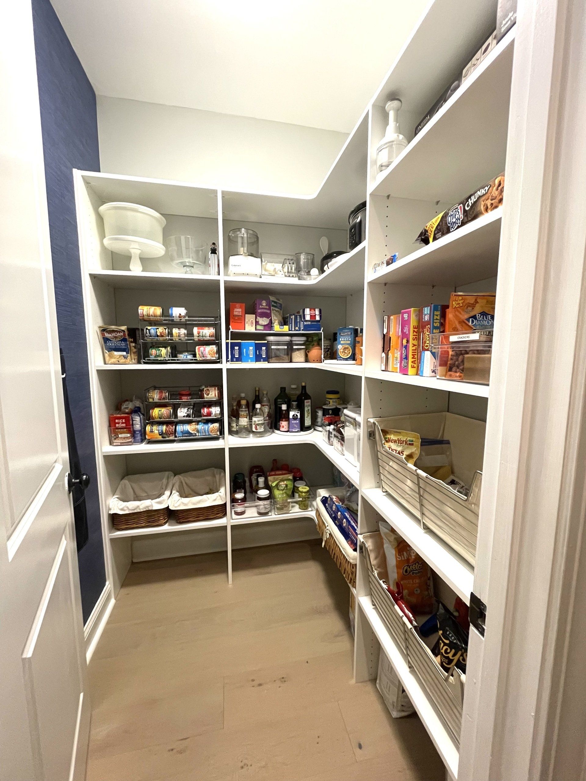 A pantry filled with lots of food and supplies.
