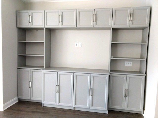 A room with a lot of cabinets and shelves