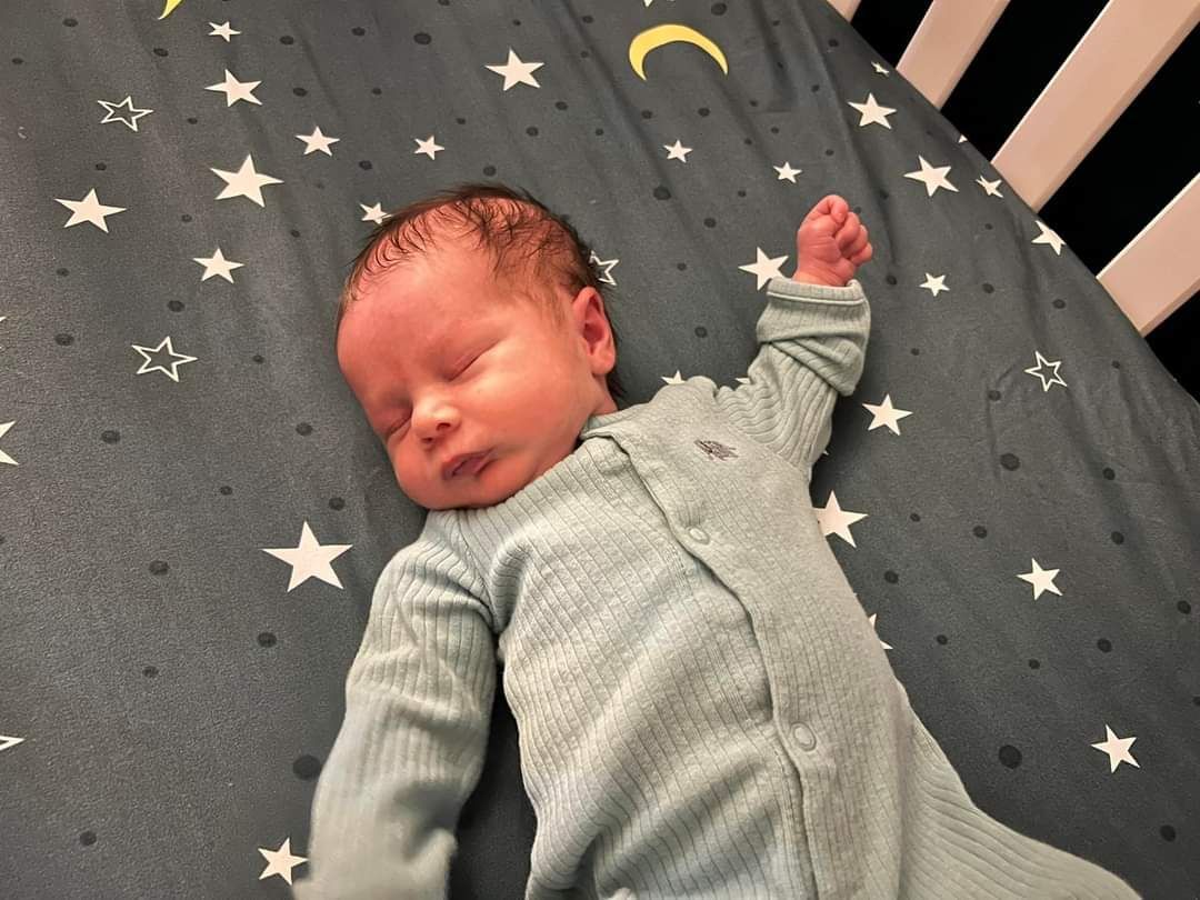 New Born Child On A Star Bed Sheet | Chattanooga, TN | Innovative Women's Health Specialists