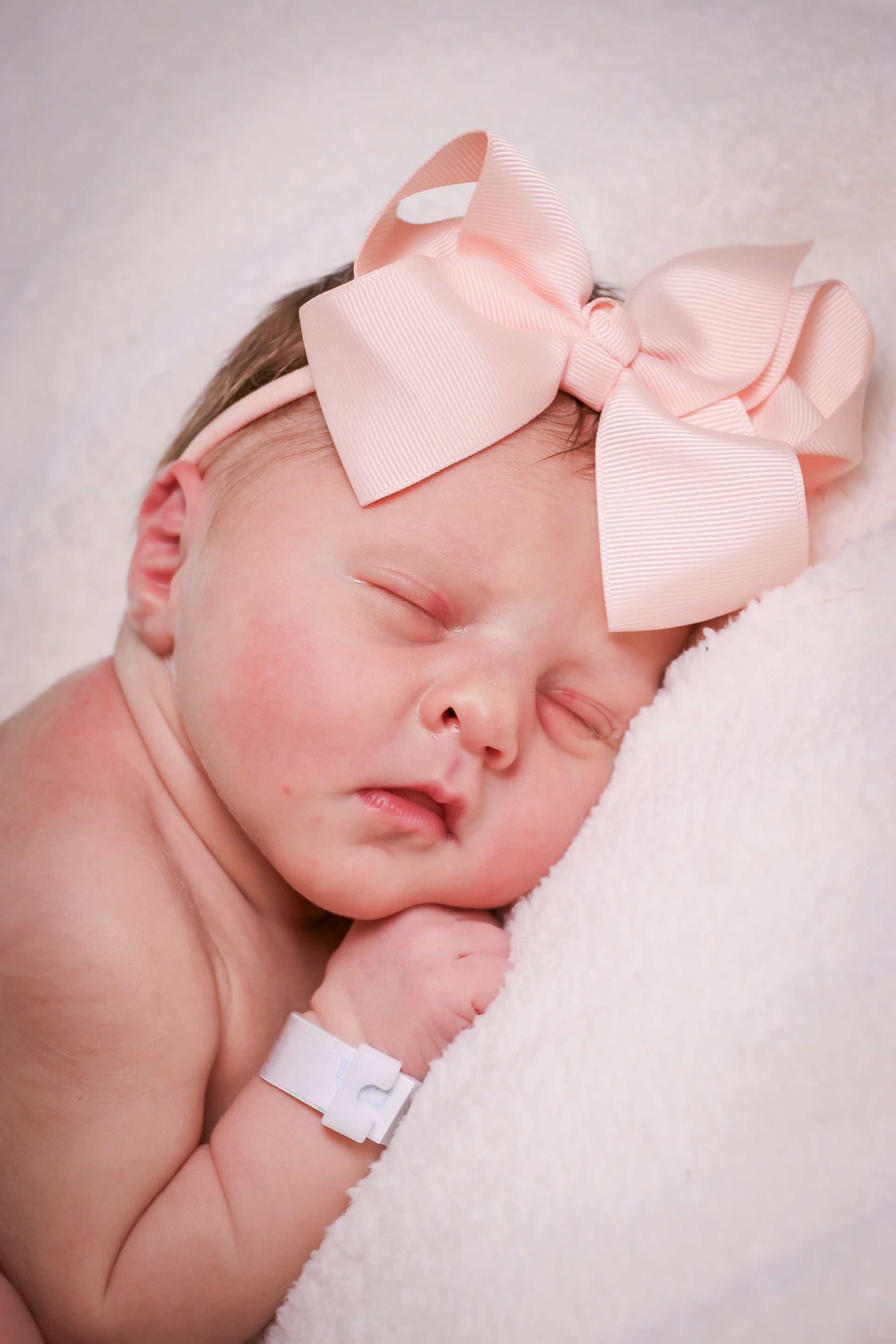 A Baby Wearing A Pink Ribbon - Chattanooga, TN - Innovative Women's Health Specialists