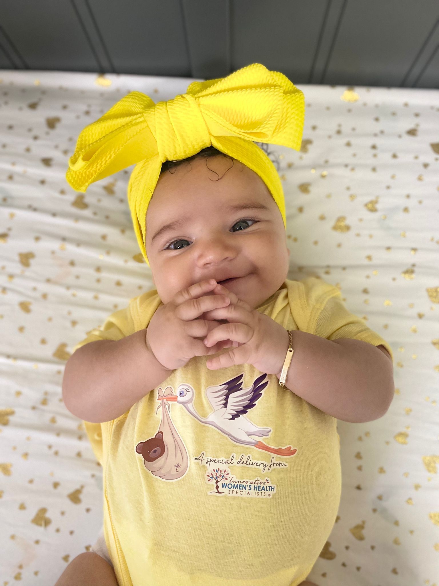 Smiling New Born On A Yellow Dress | Chattanooga, TN | Innovative Women's Health Specialists