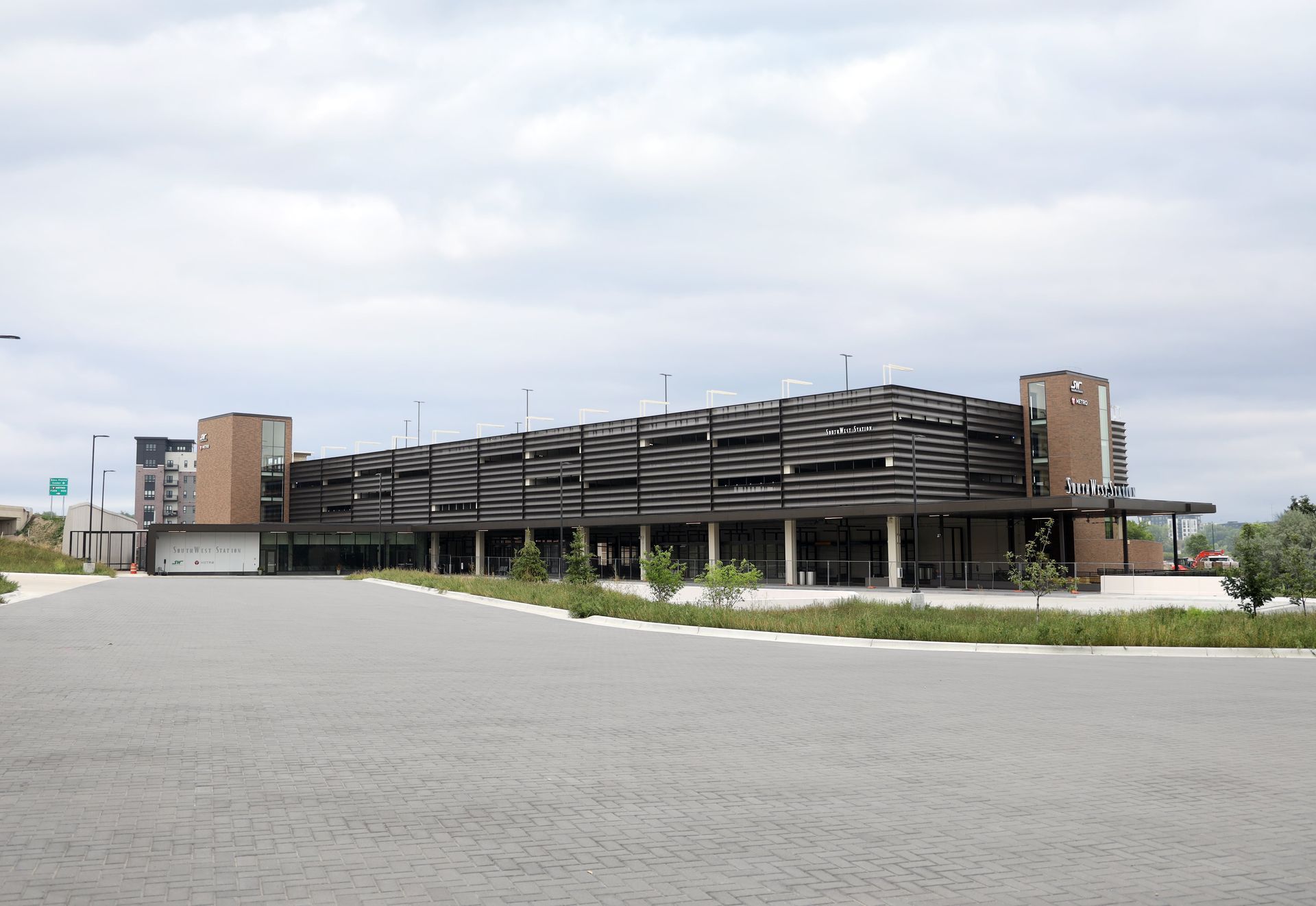 A large building with a lot of parking spaces in front of it.