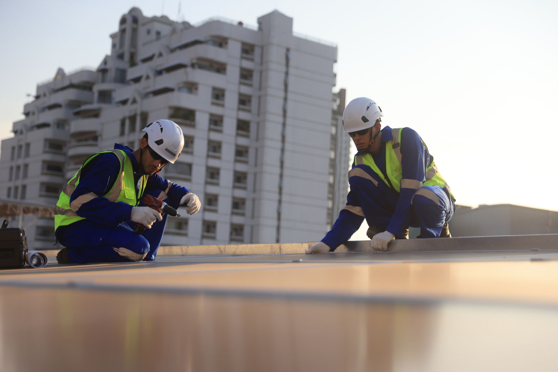 Roofing contractors from Berwald Roofing Inc. performing flat roof repair in Minneapolis, MN, ensuri