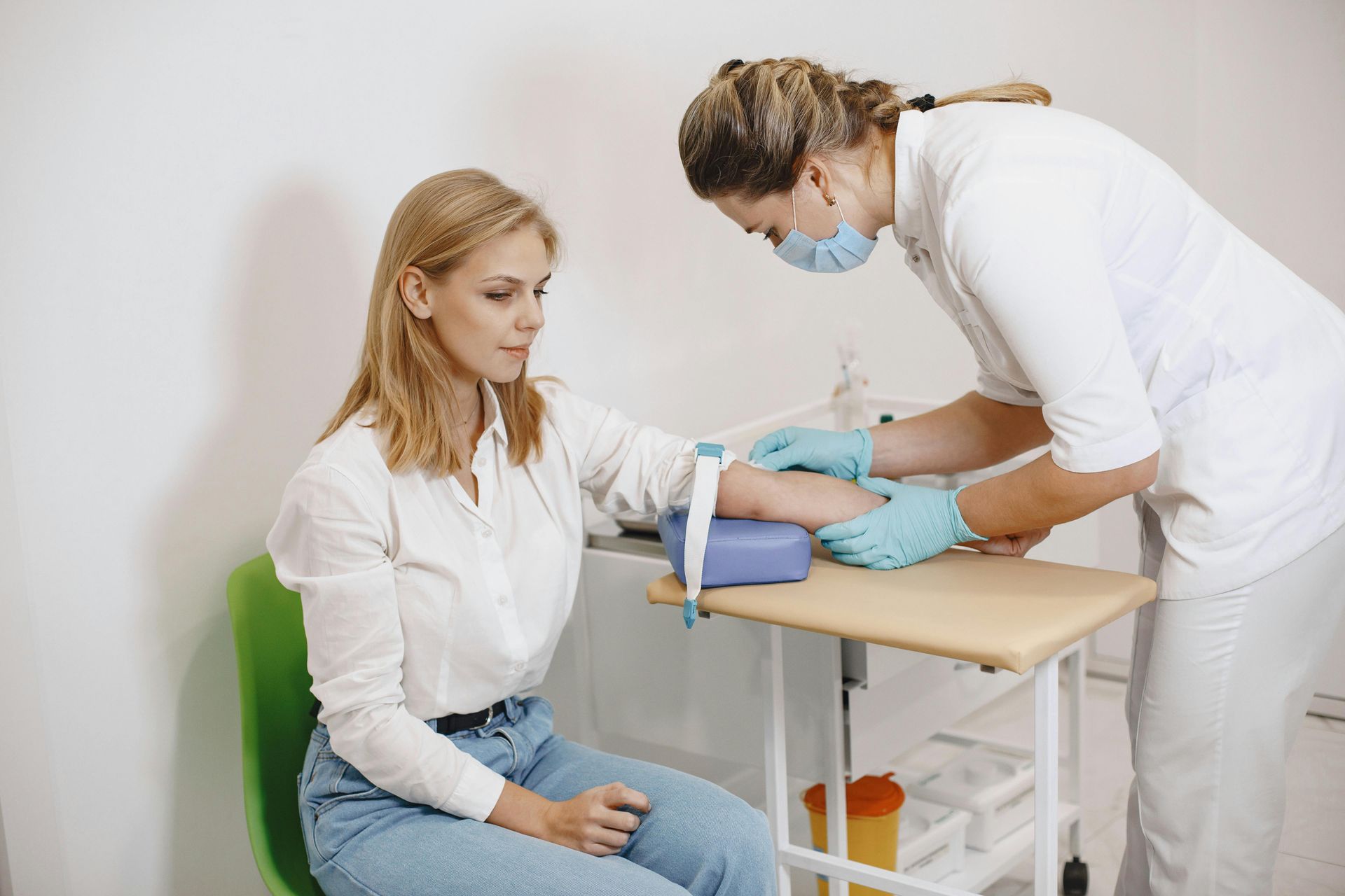 A lady inside an urgent care clinic having STA testing.