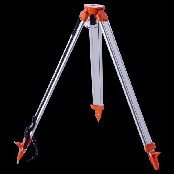 A tripod with orange feet is sitting on a black surface.