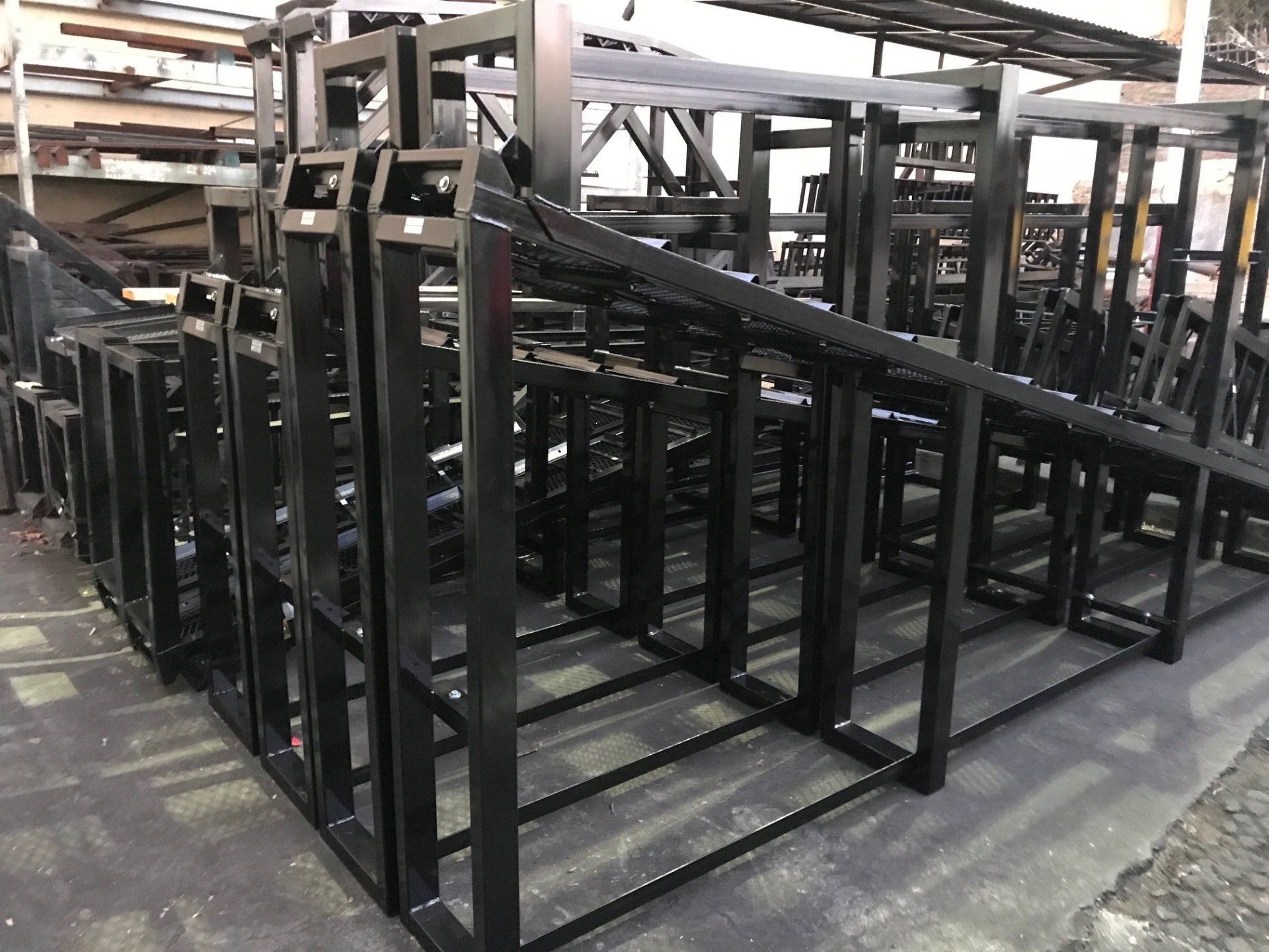 A bunch of metal frames are stacked on top of each other