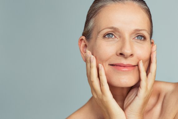 A woman is getting a nano Fractionated Microneedling treatment on her face.