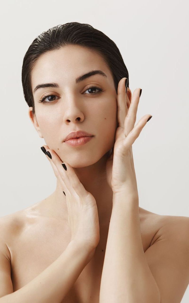 A woman is getting an Inmode Form Skin Tightening treatment on her face.