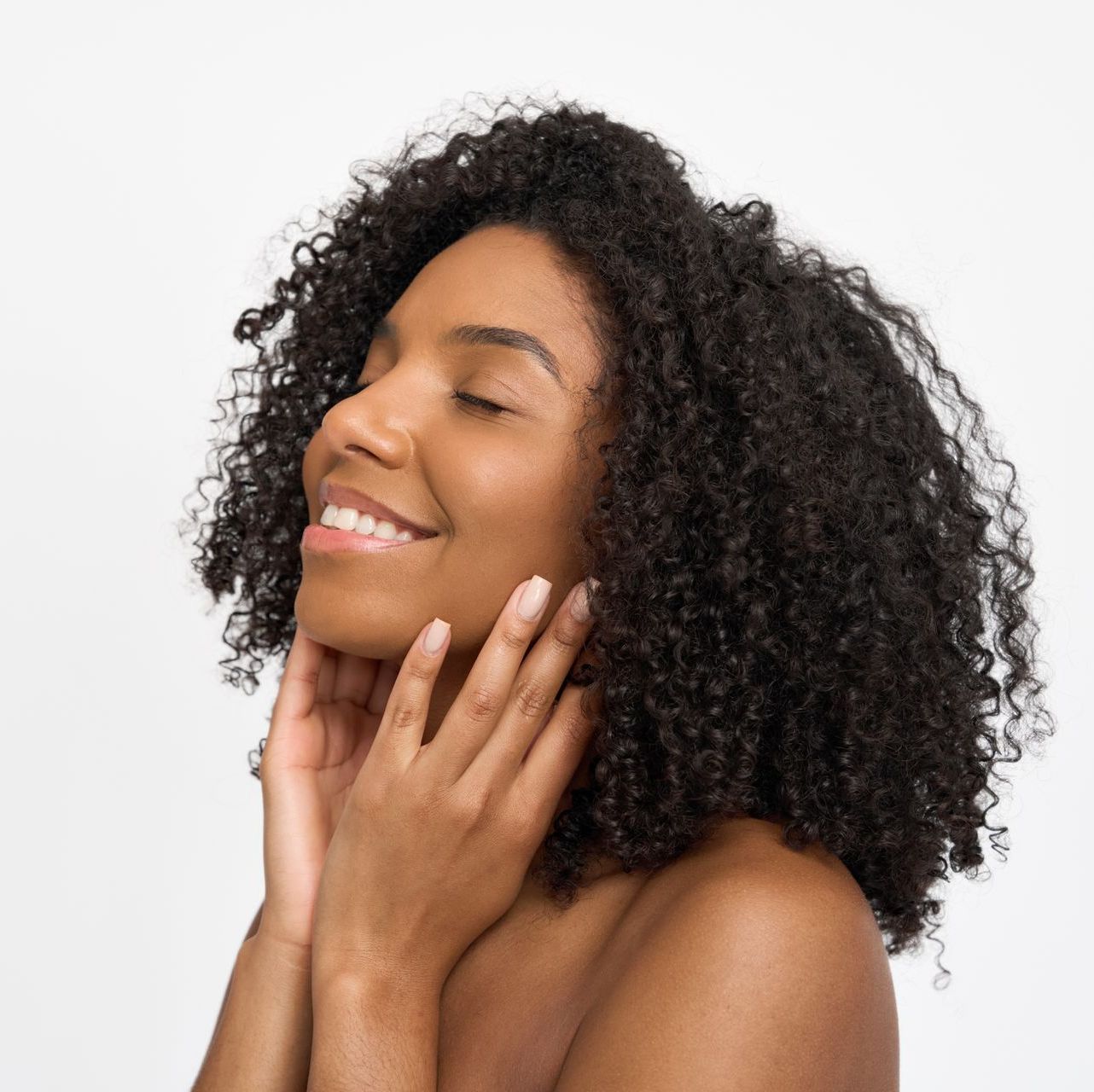 A woman is getting a facial treatment at a beauty salon.