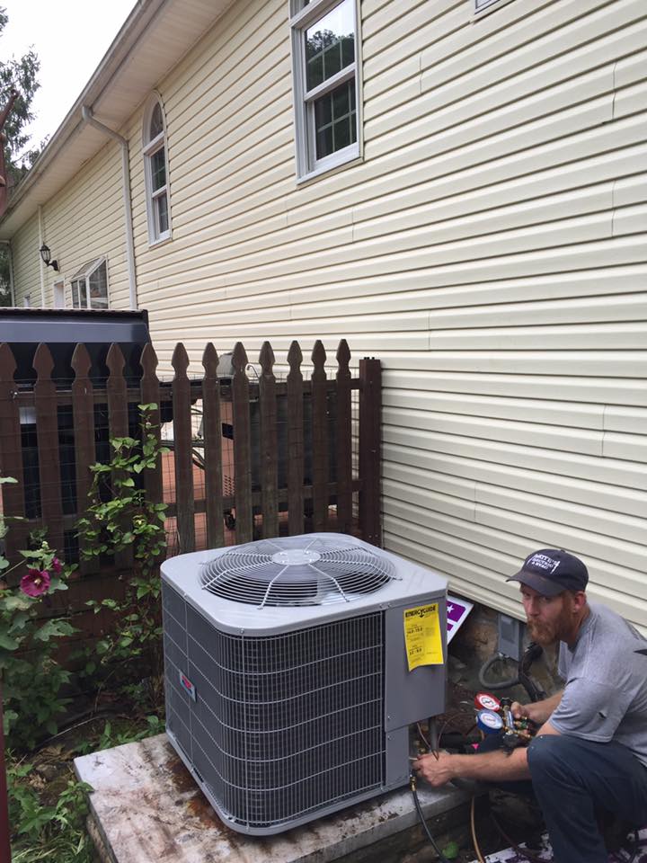 Air Conditioning Compressor — Technician Checking the AC in Williamson, WV