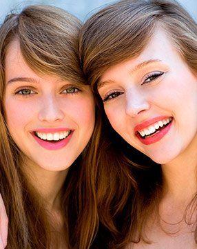 Two young women are smiling for a picture together