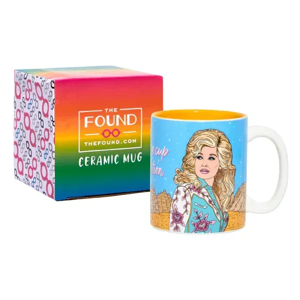 A ceramic mug with a picture of dolly parton on it
