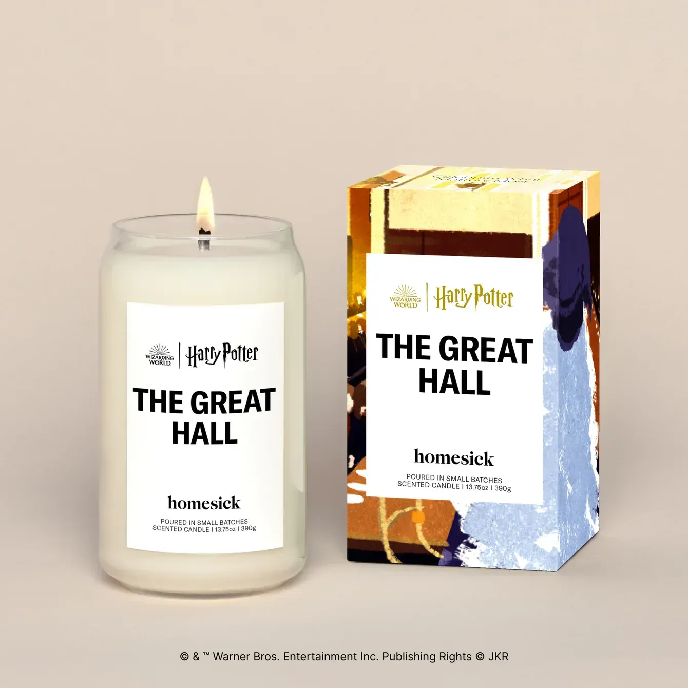 A candle that says the great hall next to a box