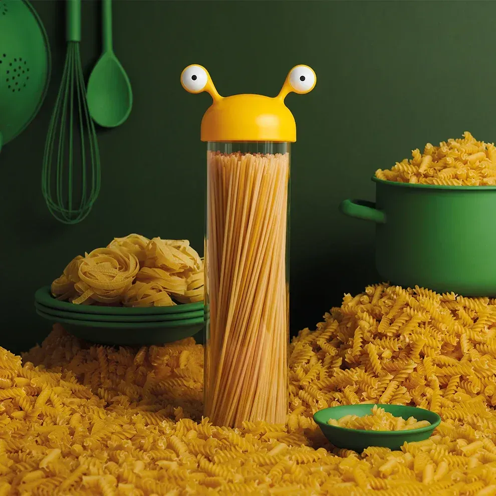 A container of spaghetti has a yellow head and eyes