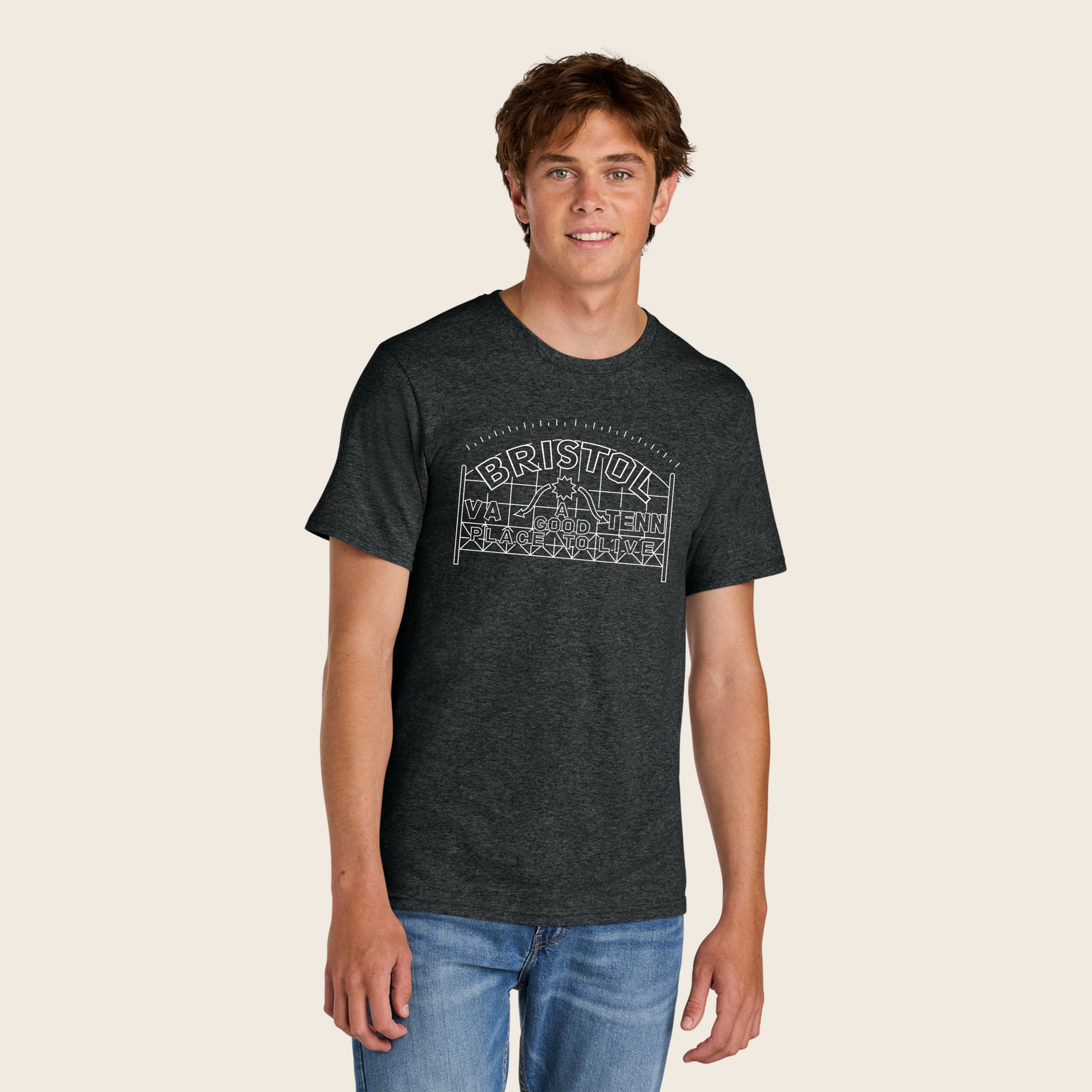 A man is wearing a black t-shirt with a white logo on it