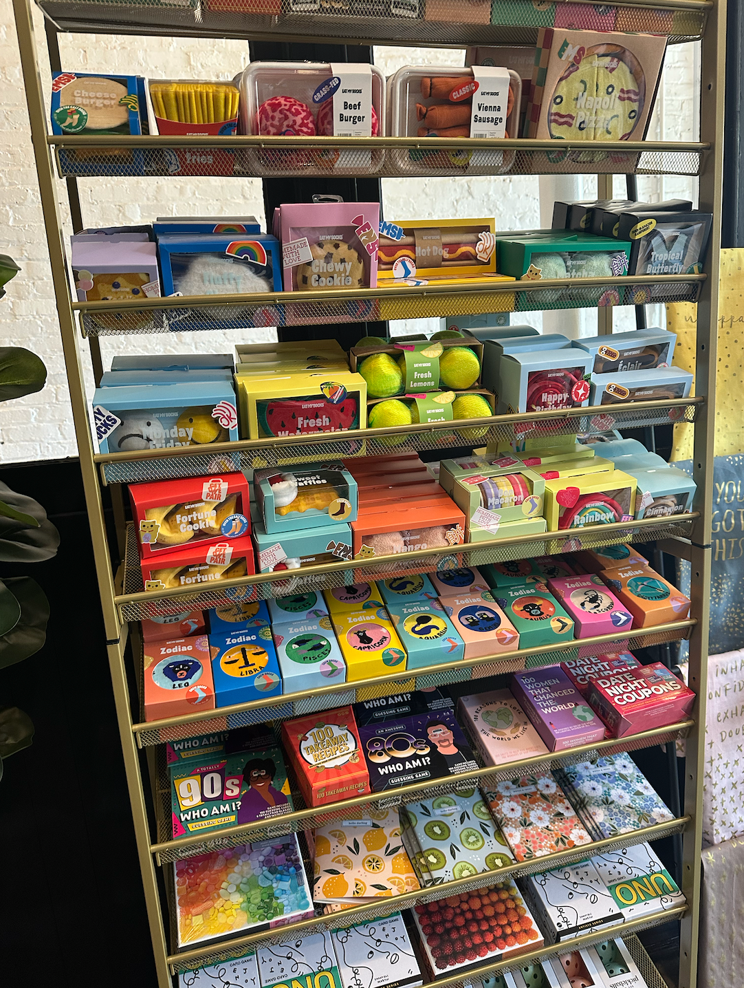 A shelf filled with lots of different types of cards.