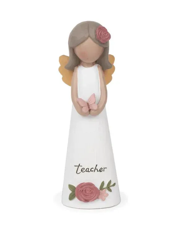 A figurine of a teacher with a flower in her hair