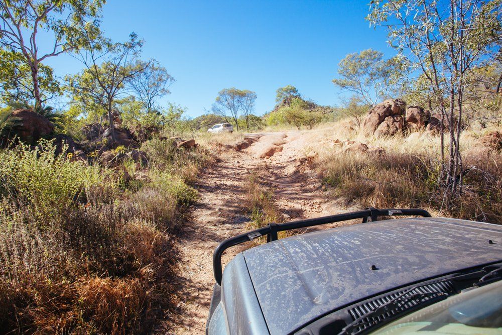A 4WD Car Negotiating A Rural Track In The Outback — Tagalong Tours in Cairns, QLD