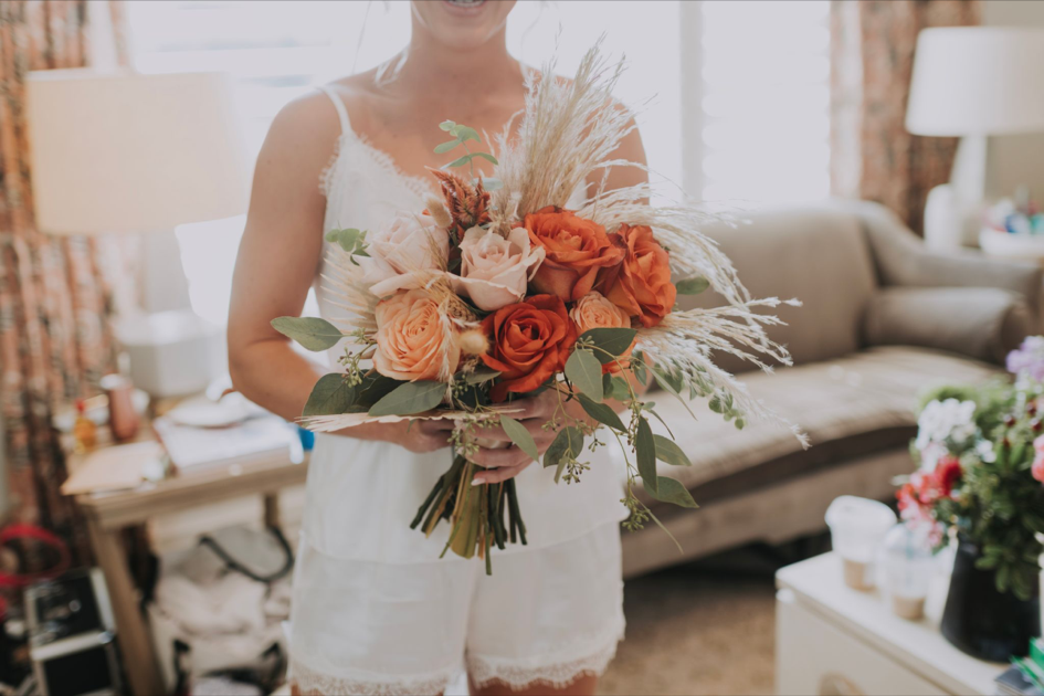 a table set for a wedding reception with candles and cups on it .