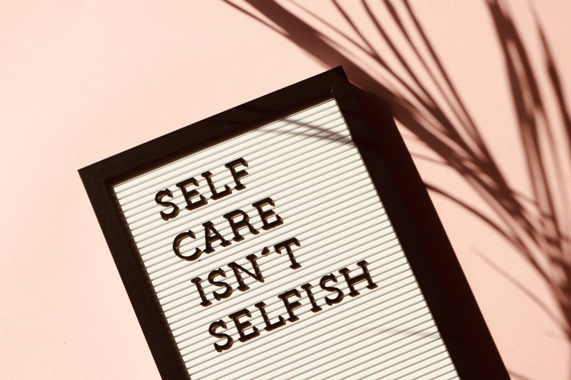 Afbeelding met tekst: Self care isn't selfish