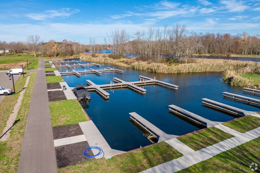 An aerial view of a marina with boats docked in the water.