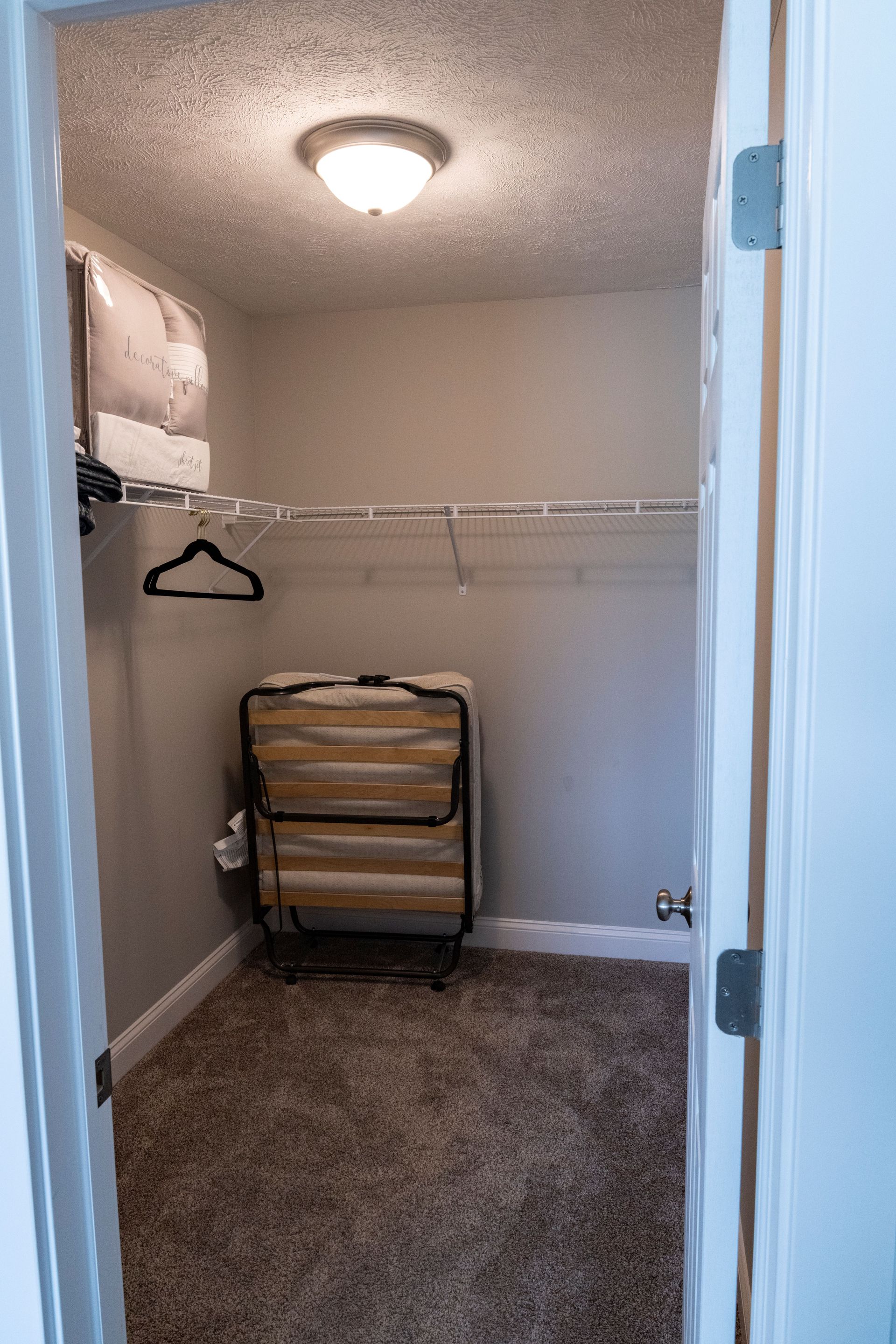 There is a folding bed in the closet.