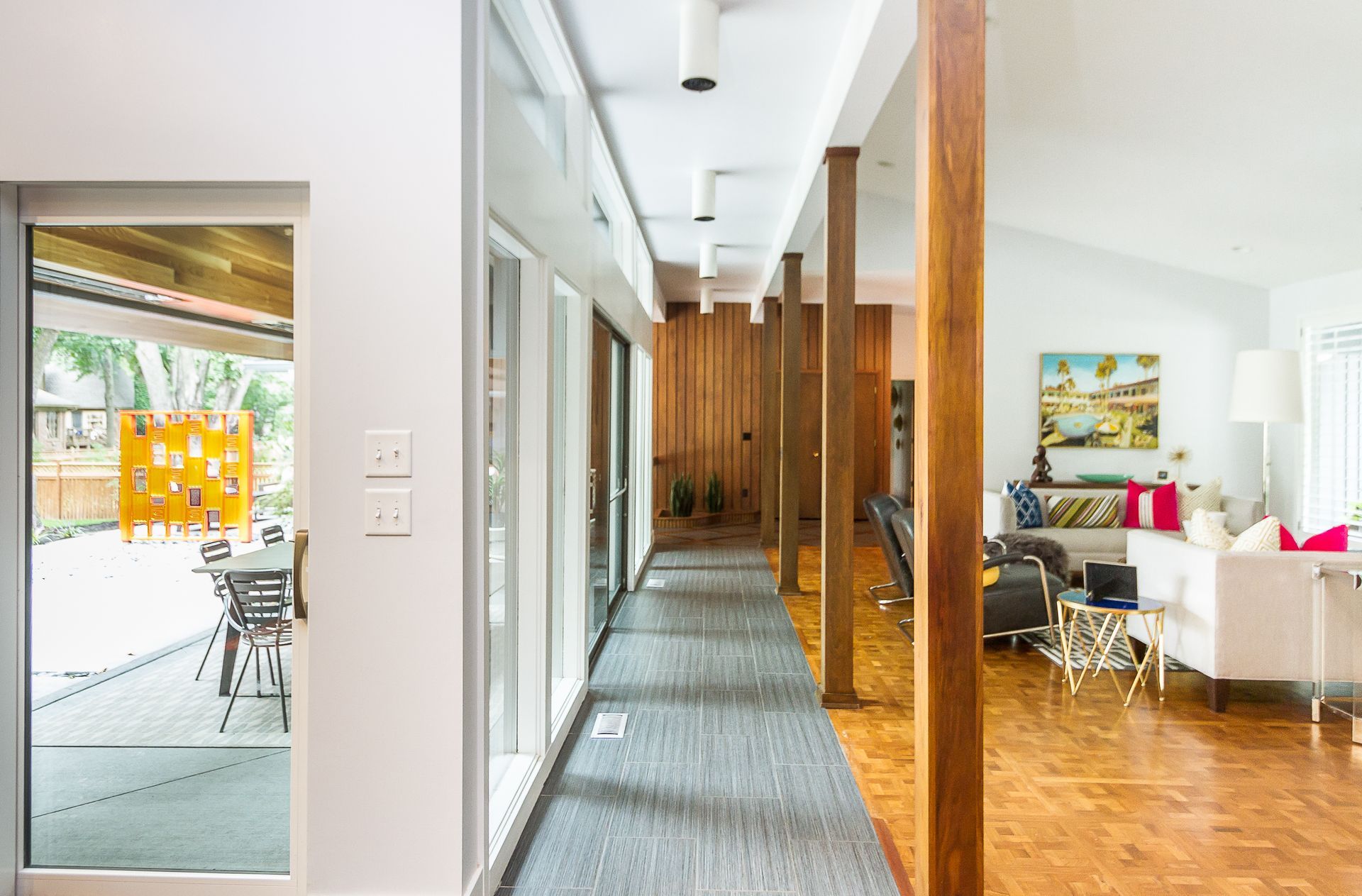 A living room with a couch , fireplace and television.