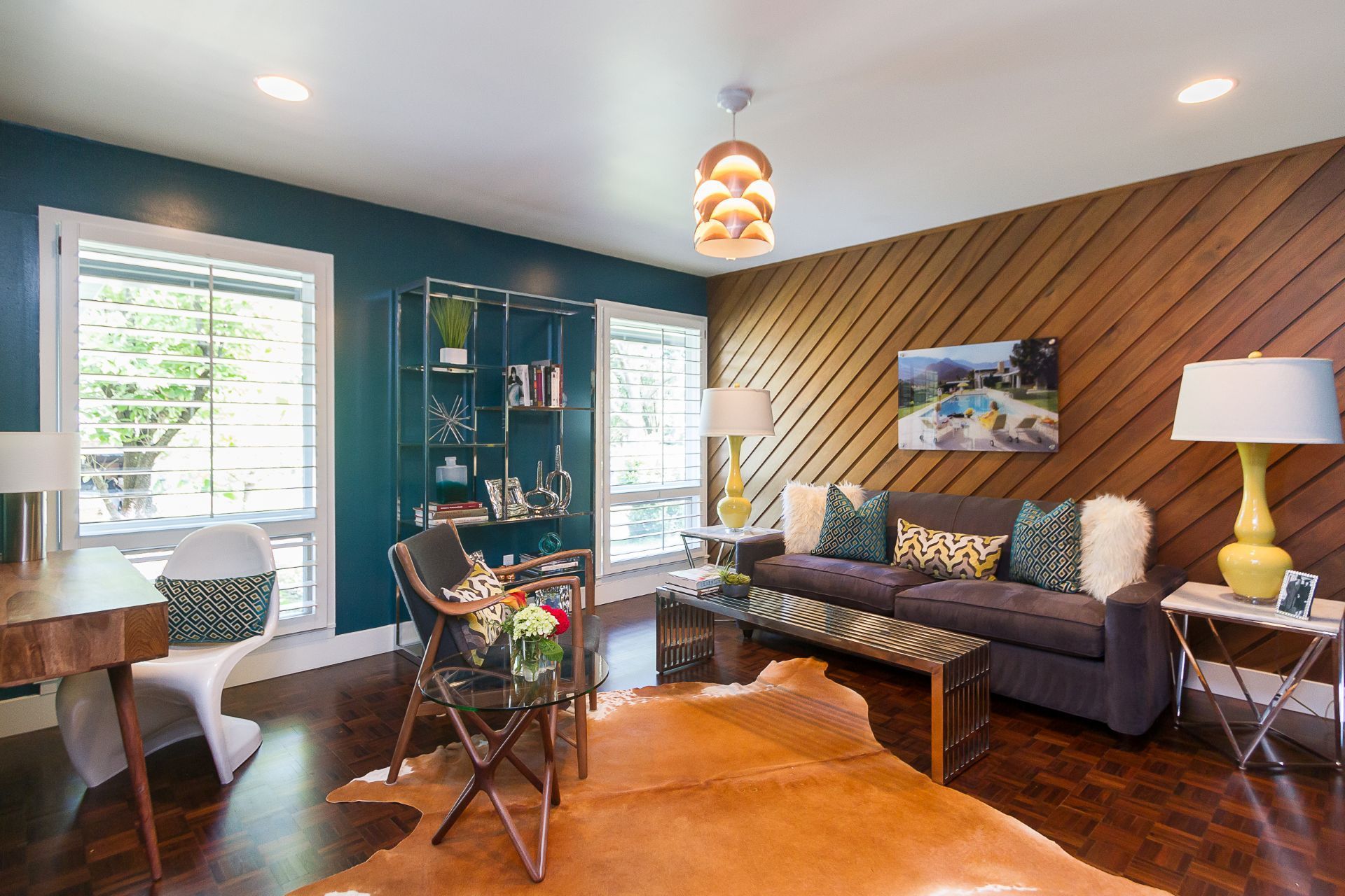 A living room with a couch , fireplace and television.
