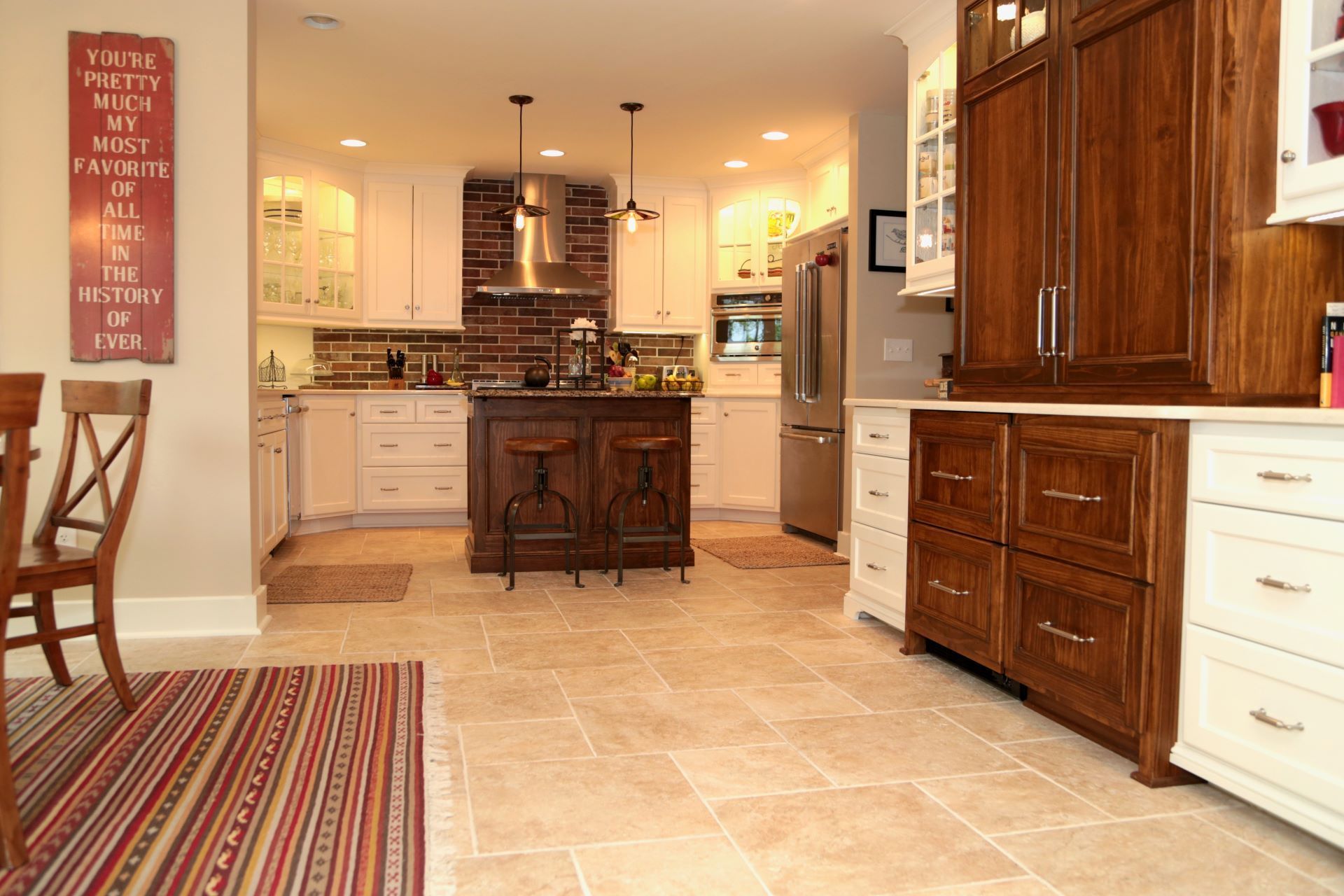 A kitchen with stainless steel appliances and wooden cabinets