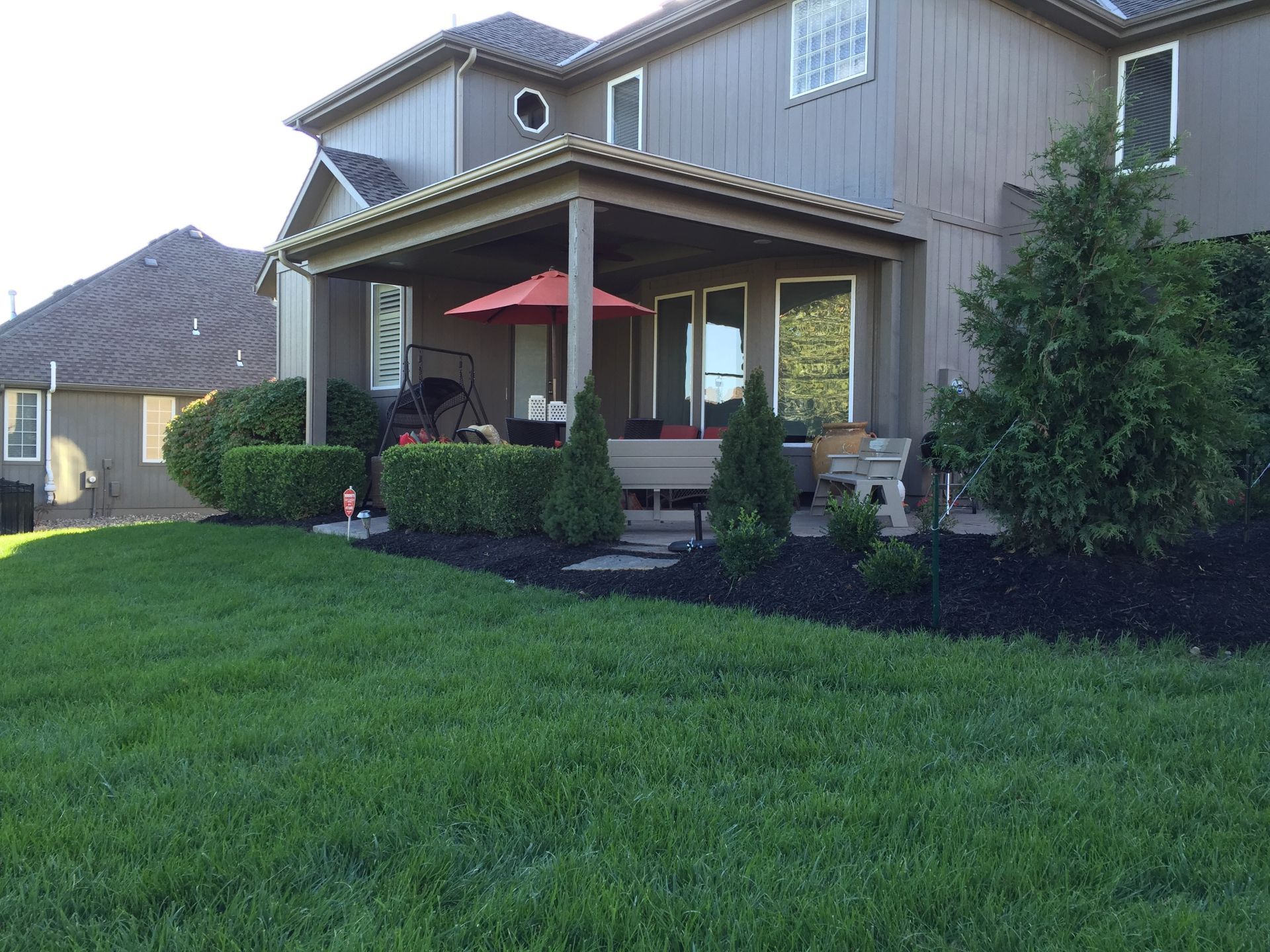A large house with a large lawn in front of it